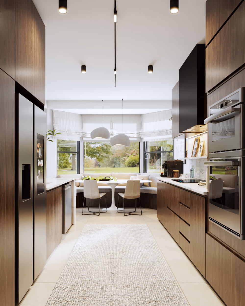 Galley kitchen with walnut cabinetry, built-in ovens, and a breakfast table by the window.