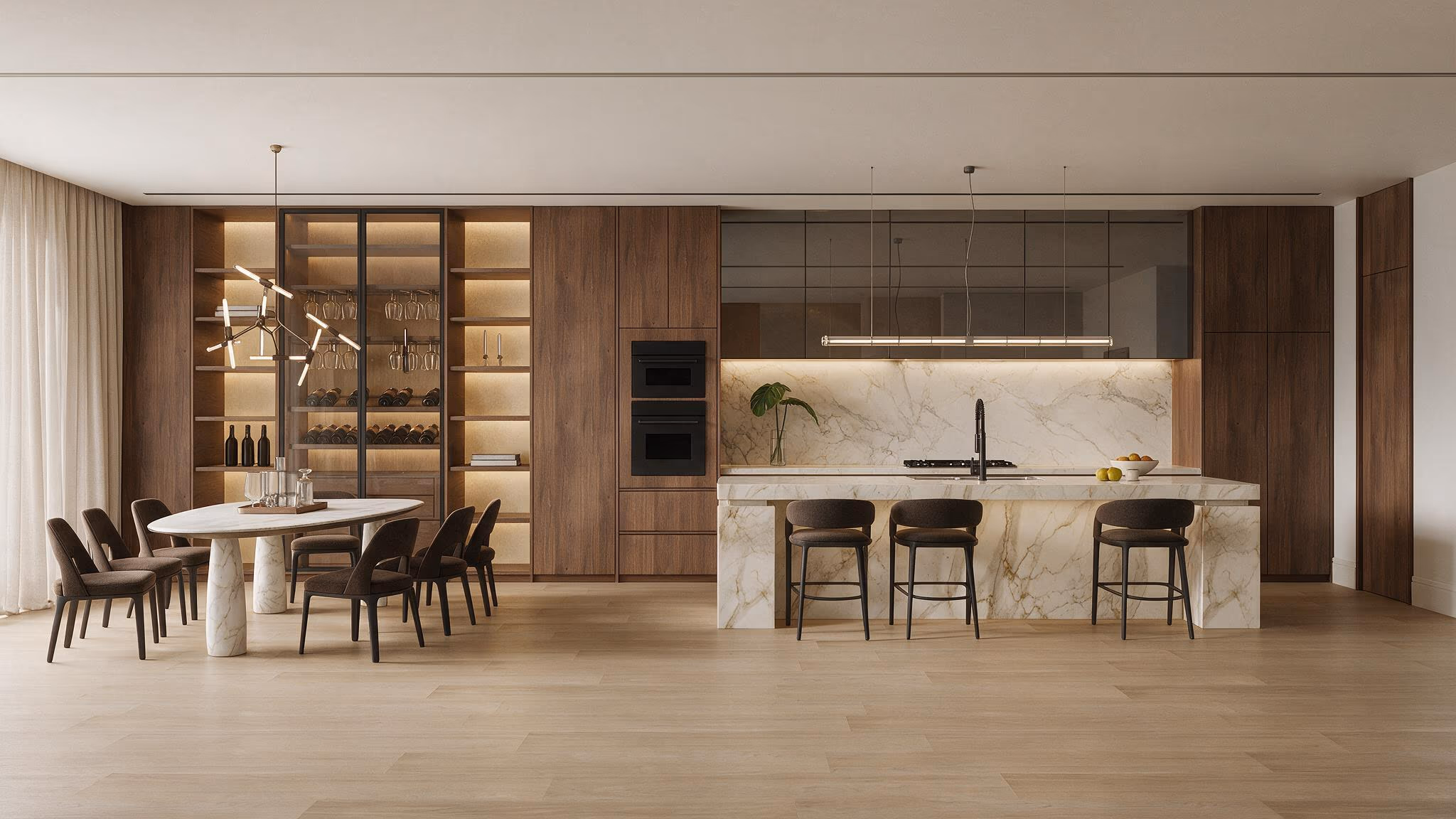 Kitchen and dining area with walnut cabinetry, a lit glass display wall, a marble island with three stools, and an oval dining table.